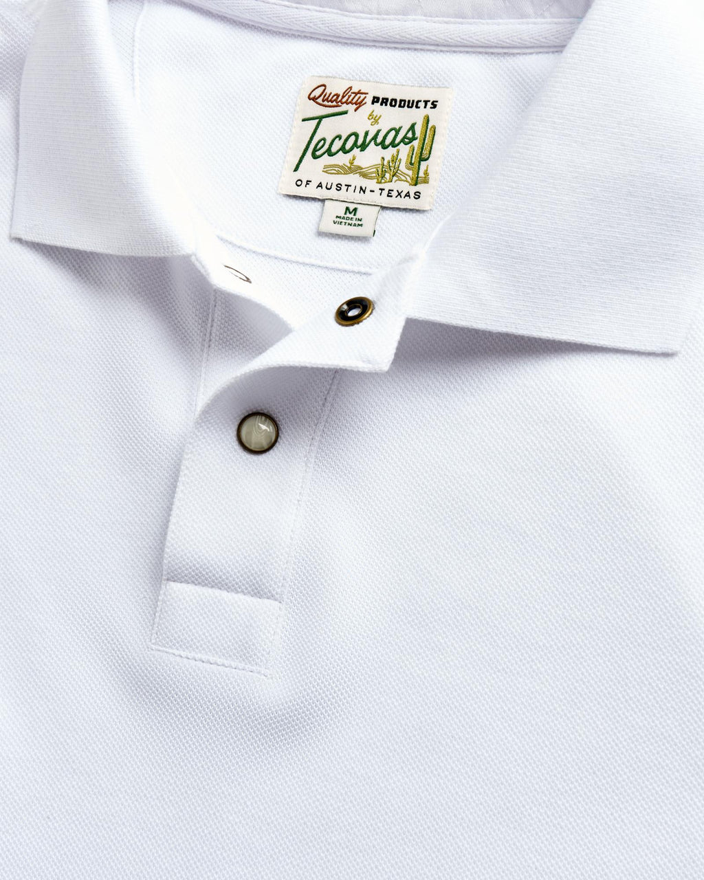 Closeup detail view of Men's Polo Pearl Snap SS - White