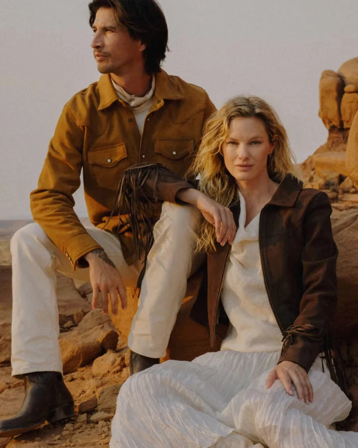 A couple wearing relaxed layers outdoors